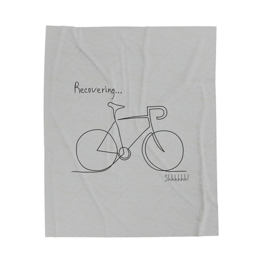 Soft throw blanket featuring a bicycle design, ideal for post-ride relaxation and recovery